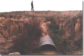 PHOTO: Downslope view of concrete gully head structure