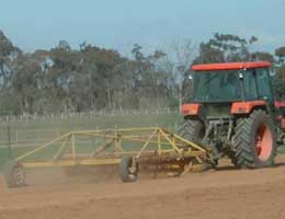 Figure 13. (a) Ripping and (b) levelling of land